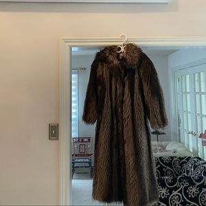 Full length woman’s raccoon coat.